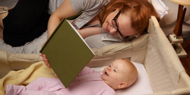 Mom reading baby bedtime story