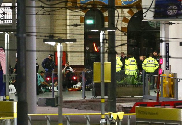 Injured concert-goers are treated by emergency services at Victoria Railway Station close to the Manchester Arena. The station has been evacuated following the explosion.