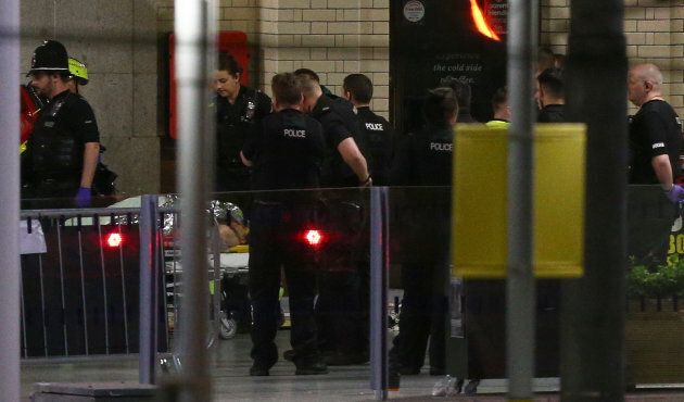 A person is wheeled away on a stretcher outside Victoria Station, close the Manchester Arena. A total of 59 people were taken to hospital following the attack.