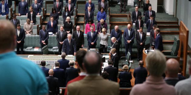 The Parliament of Australia stands to observe the victims of the Manchester terrorist attack during question time at Parliament House.