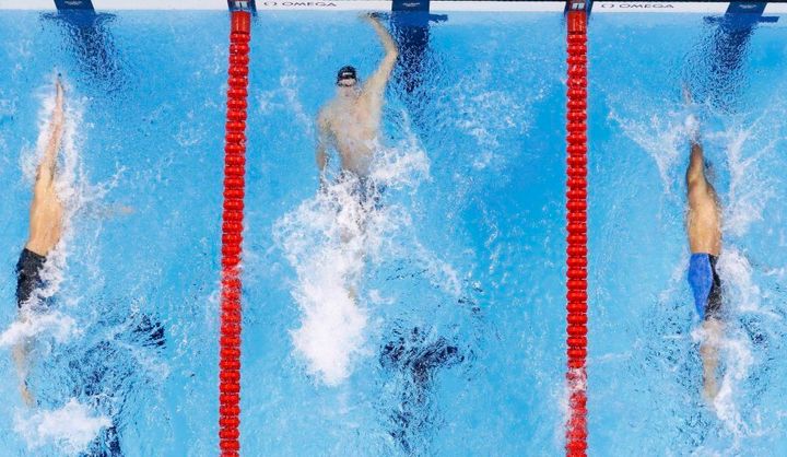 The finish of the men's 100m backstroke. Larkin is out of the picture to the left.