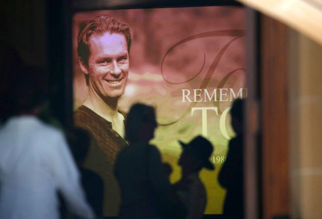 An image of Sydney cafe siege victim, cafe manager Tori Johnson is projected on a giant screen at his funeral at St Stephens Uniting Church in Sydney.