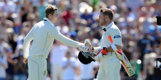 New Zealandâs captain Brendon McCullum, right, shakes hands with Australiaâs captain Steve Smith as he makes his way to the crease in his final test on the first day of the second International Cricket Test match at Hagley Park Oval in Christchurch, New Zealand, Saturday Feb. 20, 2016. (Ross Setford/SNPA via AP) NEW ZEALAND OUT
