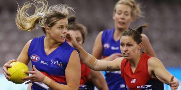 MELBOURNE, AUSTRALIA - AUGUST 16: Katie Brennan of the Bulldogs looks upfield during a Women's AFL exhibition match between Western Bulldogs and Melbourne at Etihad Stadium on August 16, 2015 in Melbourne, Australia. (Photo by Michael Dodge/Getty Images)