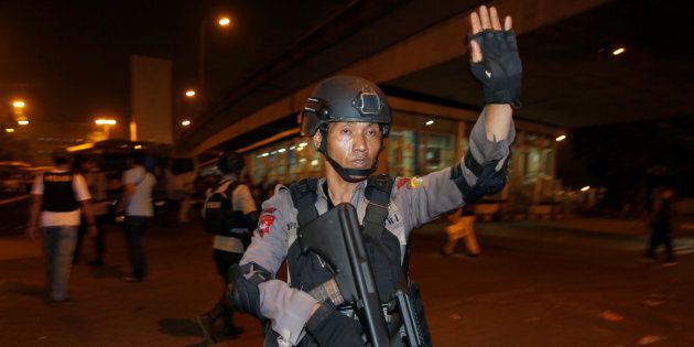 Police guard at a scene of an explosion in Jakarta on Wednesday night.