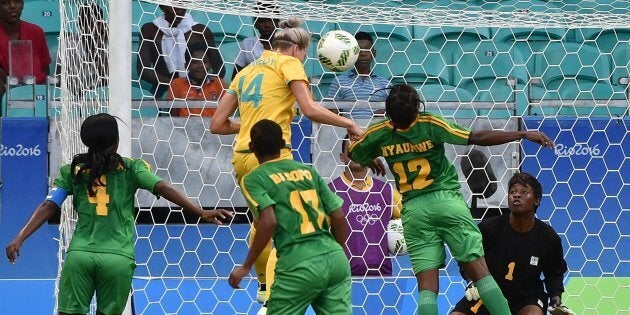 Alanna Kennedy heads to score against Zimbabwe.