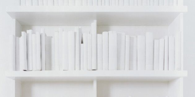 White covered books on bookshelf