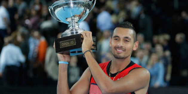 Nick Kyrgios of Australia holds his trophy after defeating Marin Cilic of Croatia, during their final match, at the Open 13 Provence tennis tournament, in Marseille, southern France, Sunday Feb. 21, 2016. (AP Photo/Claude Paris)