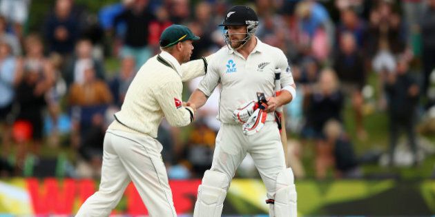 CHRISTCHURCH, NEW ZEALAND - FEBRUARY 22: Brendon McCullum of New Zealand is congraulated by David Warner of Australia as he walks from the ground after his final test innings during day three of the Test match between New Zealand and Australia at Hagley Oval on February 22, 2016 in Christchurch, New Zealand. (Photo by Ryan Pierse/Getty Images)