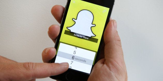 LONDON, ENGLAND - OCTOBER 06: In this photo illustration the Snapchat app is used on an iPhone on October 6, 2014 in London, England. Snapchat allows users' messages to vanish after seconds. It is being reported that Yahoo may invest millions of dollars in the start up firm. (Photo by Peter Macdiarmid/Getty Images)