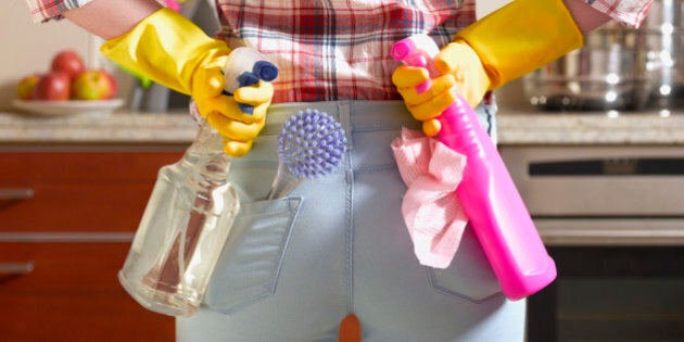 Girl preparing to spring clean kitchen