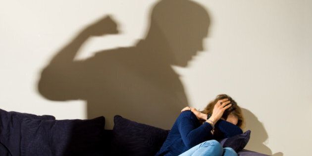 PICTURE POSED BY MODEL A shadow of a man with a clenched fist as a woman cowers in the corner, as government changes to the rules for obtaining legal aid in domestic violence cases have been declared legally flawed by the Court of Appeal.