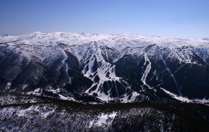 The slopes of Thredbo with Mt Kosciuszko (white hump, just to the right of middle) in the background.