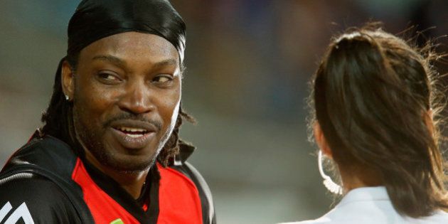 HOBART, AUSTRALIA - JANUARY 04: Chris Gayle of the Melbourne Renegades gives a TV interview to Mel Mclaughlin during the Big Bash League match between the Hobart Hurricanes and the Melbourne Renegades at Blundstone Arena on January 4, 2016 in Hobart, Australia. (Photo by Darrian Traynor/Getty Images)