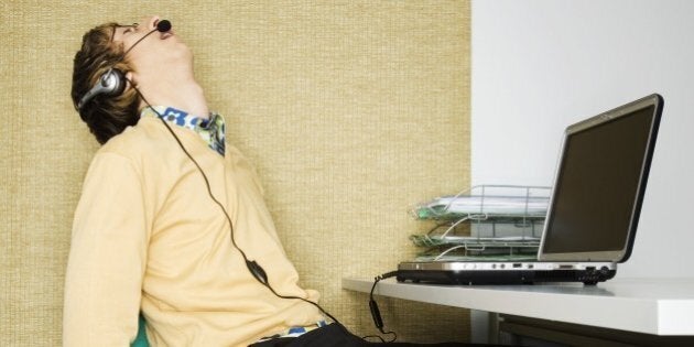 Man Sleeping at His Desk