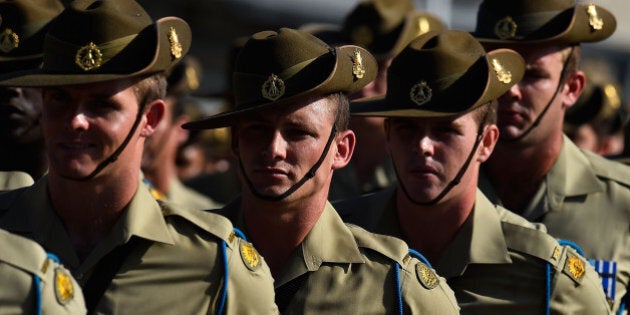 TOWNSVILLE, AUSTRALIA - NOVEMBER 23: Australian soldiers from the Royal Australian Regiment march onto the parade ground at Lavarack Barracks on November 23, 2015 in Townsville, Australia. This month marks the 70th Anniversary of the formation of the 65th, 66th and 67th Battalions, later to be the 1st, 2nd and 3rd Battalions, The Royal Australian Regiment. (Photo by Ian Hitchcock/Getty Images)