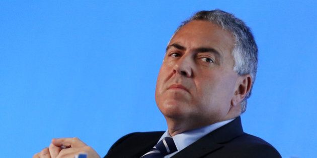 Australian Treasurer Joe Hockey listens to questions during a panel discussion at the B20 Australia Summit in Sydney, Friday, July 18, 2014. The B20 was set up in 2010 to give policy recommendations on behalf of the international business community to the G20 member countries. (AP Photo/Nikki Short, Pool)