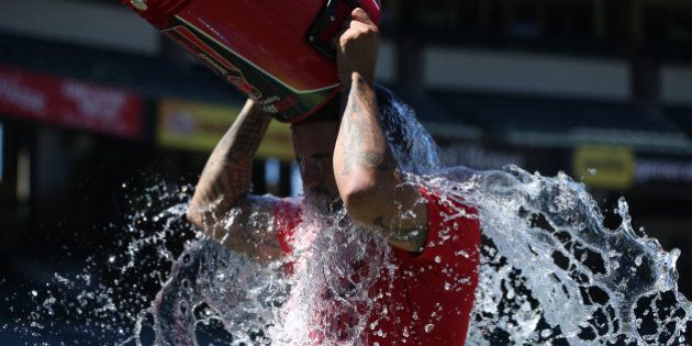 ANAHEIM, CA - AUGUST 4: Pitcher Hector Santiago #53 of the Los Angeles Angels of Anaheim takes the ALS Ice Bucket Challenge before the game against the Cleveland Indians at Angel Stadium of Anaheim on August 4, 2015 in Anaheim, California. (Photo by Josh Barber/Angels Baseball LP/Getty Images)
