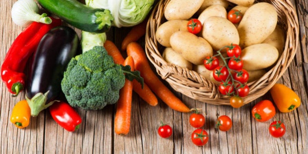 Fresh vegetable on old wooden table, top view