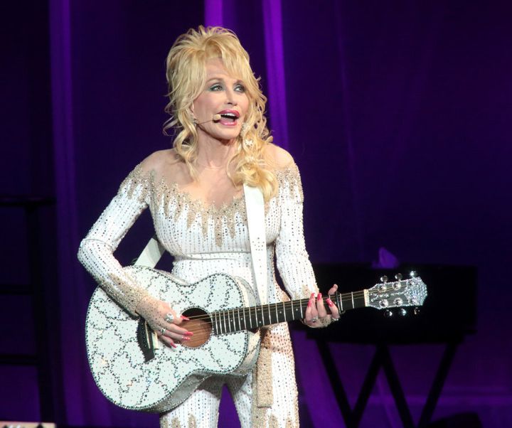 Happy customer: Dolly Parton has no regrets over her breast implants.