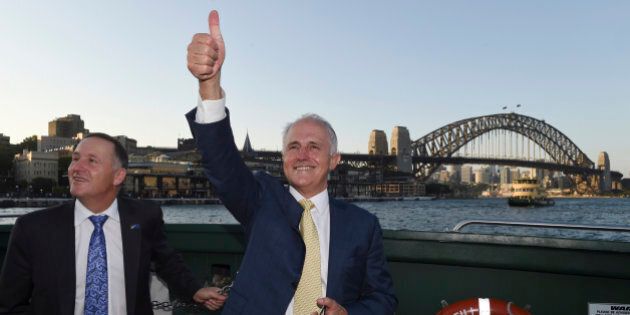 Australian Prime Minister Malcolm Turnbull, right, and New Zealand Prime Minister John Key travel on a ferry on Sydney Harbour with a backdrop of the Sydney Harbour Bridge in Sydney, Friday, Feb. 19, 2016. Turnbull and Key are traveling to Turnbull's home. (AP Photo/Dean Lewins, Pool)