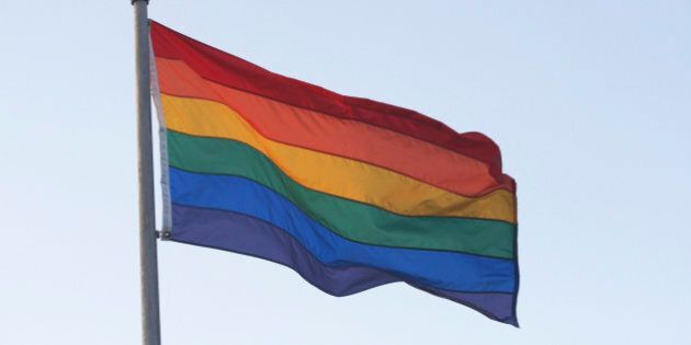 Rainbow flag blowing in wind
