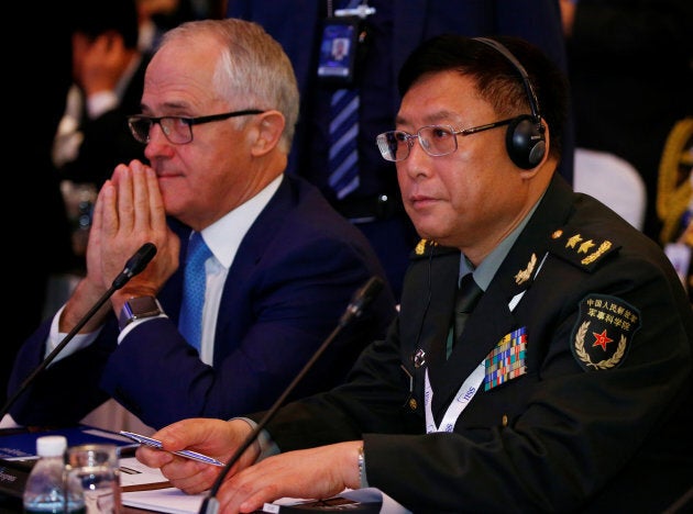 Prime Minister Malcolm Turnbull sitting next to China's Vice President of Academy of Military Science, He Lei, at the Shangri-La Dialogue.