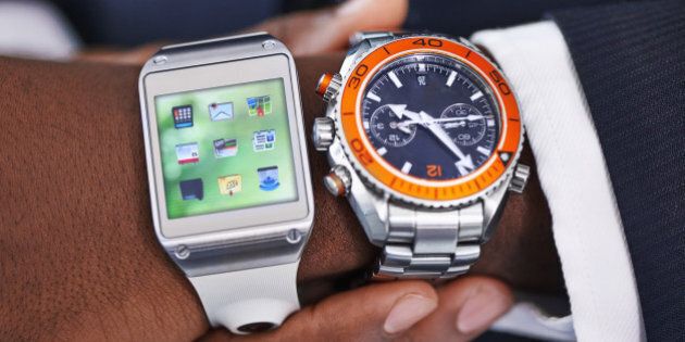 Cropped view of a young businessman wearing a smartwatch and a traditional watch - All screen content is designed by us and not copyrighted by othershttp://195.154.178.81/DATA/i_collage/pi/shoots/783764.jpg