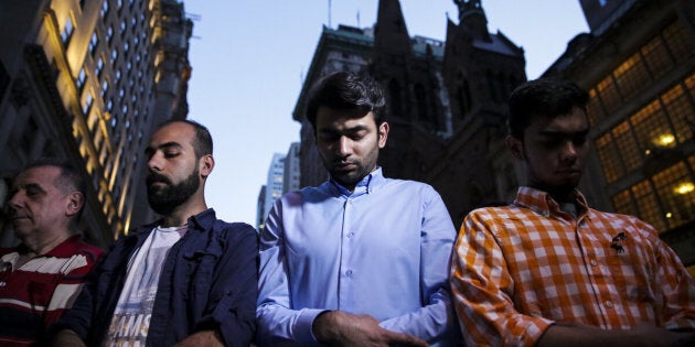 Demonstrators pray during an Iftar outside of Trump Tower in New York, U.S., on Thursday, June 1, 2017. The Justice Department vowed to challenge an appeals court ruling that slammed a travel ban against six Muslim majority nations as being 'steeped in animus,' putting President Donald Trump on track for his first Supreme Court showdown. Photographer: Jeenah Moon/Bloomberg via Getty Images