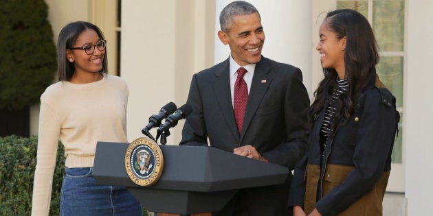 Former U.S. President Barack Obama with his daughters, Sasha and Malia, during an annual turkey pardoning ceremony.