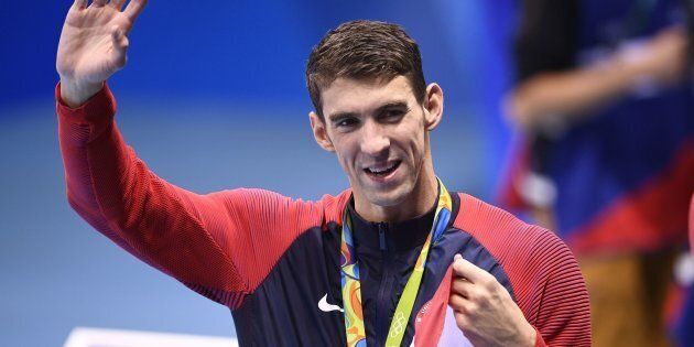 Michael Phelps waves from the podium at the Olympic aquatics stadium on Thursday in Rio de Janeiro, Brazil.