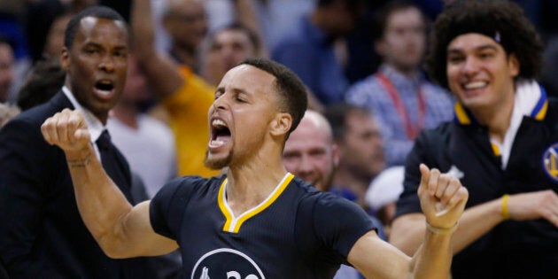 Golden State Warriors guard Stephen Curry (30) celebrates after hitting the game-winning shot in overtime of an NBA basketball game against the Oklahoma City Thunder in Oklahoma City, Saturday, Feb. 27, 2016. Golden State won 121-118. (AP Photo/Sue Ogrocki)