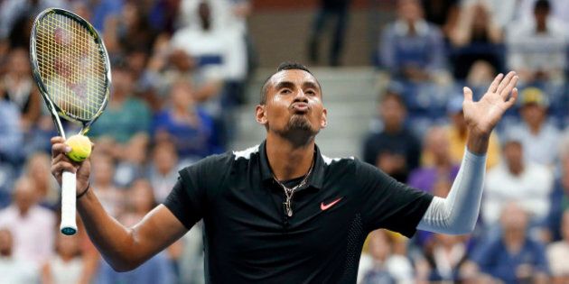 Nick Kyrgios, of Australia, reacts between points against Andy Murray, of Britain, during the first round of the U.S. Open tennis tournament in New York, Tuesday, Sept. 1, 2015. (AP Photo/Julio Cortez)