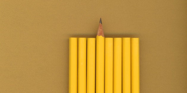 Sharpened pencil next to unsharpened pencils