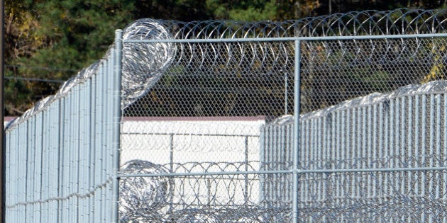 BUTNER, NC - NOVEMBER 20: The fence around the federal prison in Butner, North Carolina where convicted Israel spy Jonathan Pollard was released from is seen on November 20, 2015 in Butner, North Carolina. Pollard, 61, spent 30 years in prison after being caught selling American intelligence secrets to Israel. The prison camp houses three levels of security on the multi-building Federal Correctional Institute campus. (Photo by Sara D. Davis/Getty Images)