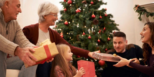 Shot of a multi-generational family exchanging gifts at Christmas