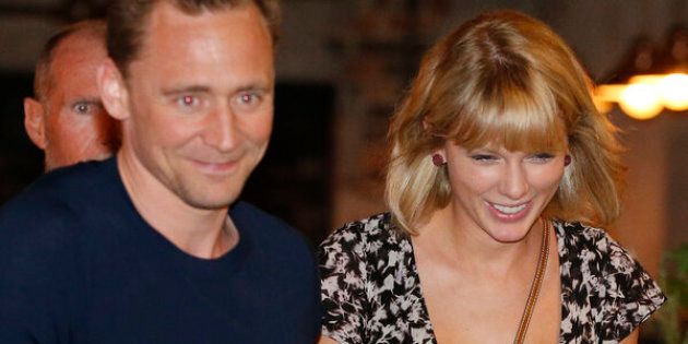Actor Tom Hiddleston and singer Taylor Swift having a grand old time during Tom's