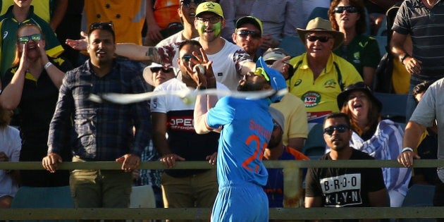 PERTH, AUSTRALIA - JANUARY 12: Shikhar Dhawan of India takes a catch to dismiss Glenn Maxwell of Australia during the Victoria Bitter One Day International Series match between Australia and India at WACA on January 12, 2016 in Perth, Australia. (Photo by Paul Kane/Getty Images)