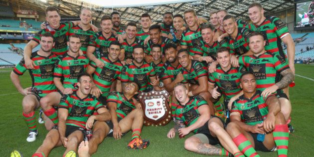 SYDNEY, AUSTRALIA - FEBRUARY 13: The Rabbitohs team celebrate with the Charity Shield after victory during the NRL Charity Shield match between the St George Illawarra Dragons and the South Sydney Rabbitohs at ANZ Stadium on February 13, 2016 in Sydney, Australia. (Photo by Mark Kolbe/Getty Images)