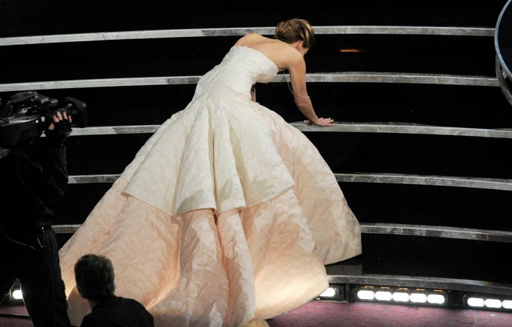 Even Oscar winners stack it in heels. Here's Jennifer Lawrence after falling over on her way to accept her Academy Award in 2013.