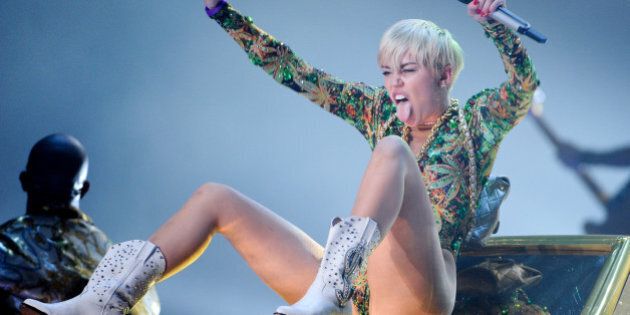 Singer Miley Cyrus performs at the Barclays Center on Saturday, April 5, 2014 in New York. Photo by Evan Agostini/Invision/AP)