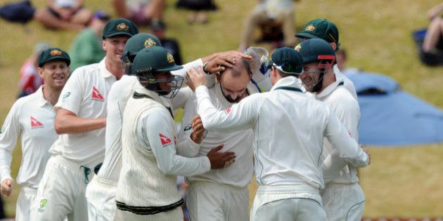 Australiaâs Nathan Lyon, centre, surrounded by team mates after bowling New Zealandâs BJ Watling for 10 on the fourth day of the first International Cricket Test match at Basin Reserve, Wellington, New Zealand, Monday, Feb 15, 2016. (Ross Setford/SNPA via AP) NEW ZEALAND OUT
