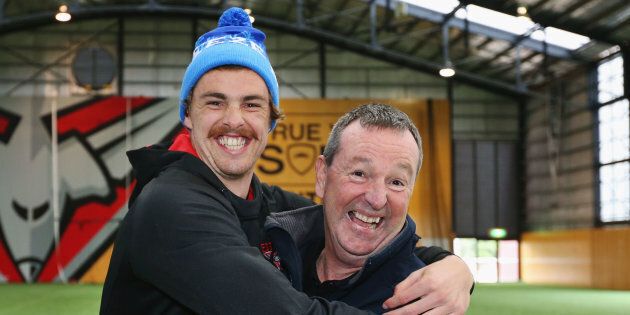 Bomber's legend Neale Daniher (R) gets a hug from nephew Joe Daniher after a cheque presentation to fight MND at the Essendon Football Club on June 5, 2017 in Melbourne, Australia.