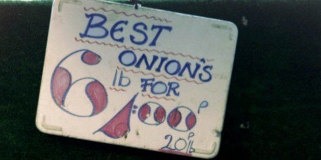 A sign advertising the price of onions is seen with an incorrect apostrophe added, at a market stall in Maida Vale, London Friday, May 11, 2001. Founders of The Apostrophe Protection Society have set out to enlighten local merchants in their northeastern county of Lincolnshire. Butchers, greengrocers, supermarket managers and even a librarian received polite letters drawing their attention to displays of aberrant punctuation and setting them straight on the difference between plural and possessive. (AP Photo/Max Nash)