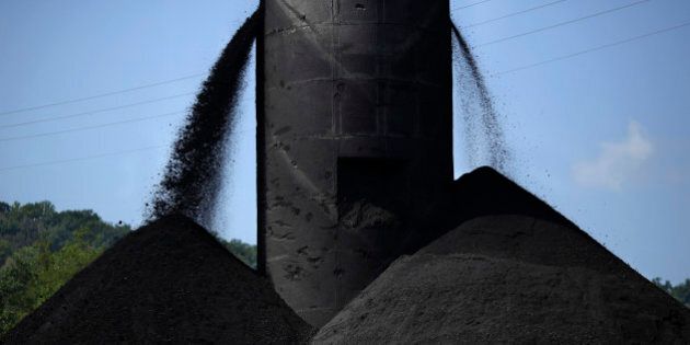 Coal spills out from a tower into a large pile at an Alpha Natural Resources Inc. coal preparation plant in Logan County near Yolyn, West Virginia, U.S., on Wednesday, Aug. 5, 2015. Alpha Natural Resources Inc. filed for bankruptcy in Virginia last week, becoming the latest victim of the coal industrys worst downturn in decades. Photographer: Luke Sharrett/Bloomberg via Getty Images