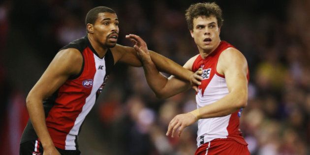 MELBOURNE, AUSTRALIA - AUGUST 30: Jason Holmes (L) of the Saints calls for the ball next to Mike Pyke of the Swans during the round 22 AFL match between the St Kilda Saints and the Sydney Swans at Etihad Stadium on August 30, 2015 in Melbourne, Australia. (Photo by Michael Dodge/Getty Images)