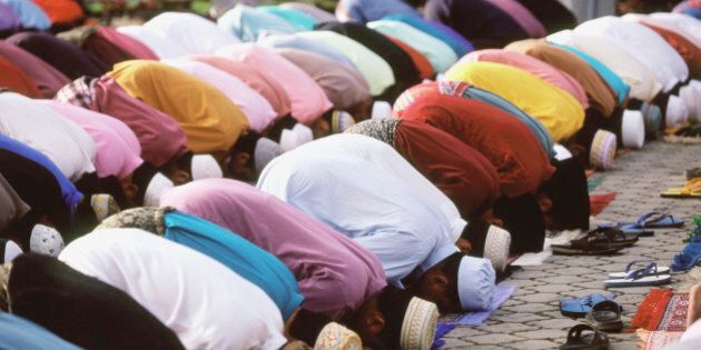 Malaysia, Kota Bahru, Muslim men praying at Kubang Kerian Mosque