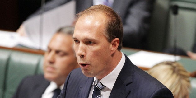 CANBERRA, AUSTRALIA - JULY 15: MInister for Health Peter Dutton during Question Time at Parliament House on July 15, 2014 in Canberra, Australia. A vote on the Government's Carbon Tax Repeal Legislation has been delayed as debate in the Senate continues. (Photo by Stefan Postles/Getty Images)