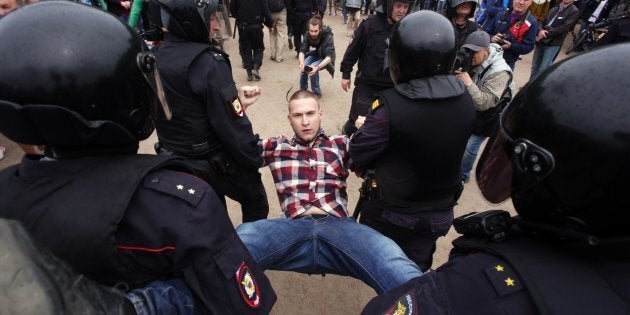 Police forcibly detained more than 1,000 protesters during unauthorised anti-corruption rallies in Russia on its national patriotic holiday.