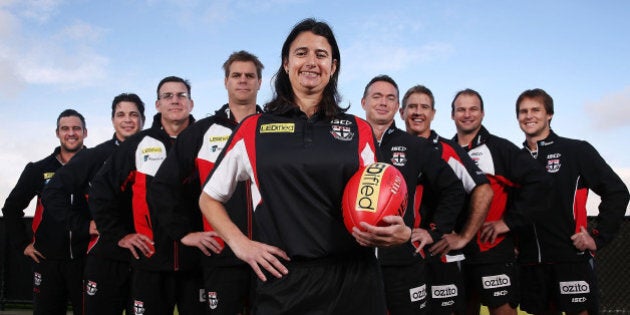 MELBOURNE, AUSTRALIA - JUNE 02: New Saints Development coach Peta Searle, the AFL's first female assistant coach, poses with the coaching team during a St Kilda Saints AFL press conference at Linen House Oval on June 2, 2014 in Melbourne, Australia. (L-R): Lindsay Gilbee, Adam Kingsley, Simon McPhee, Danny Sexton, Peta Searle, Alan Richardson, Paul Hudson, Aaron Hamill and David Teague. (Photo by Michael Dodge/Getty Images)